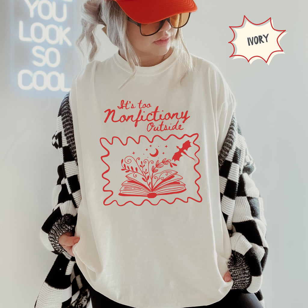 Fantasy reader shirt mockup featuring the phrase It’s Too Nonfictiony Outside in a playful bookish design for introverted fiction lovers.